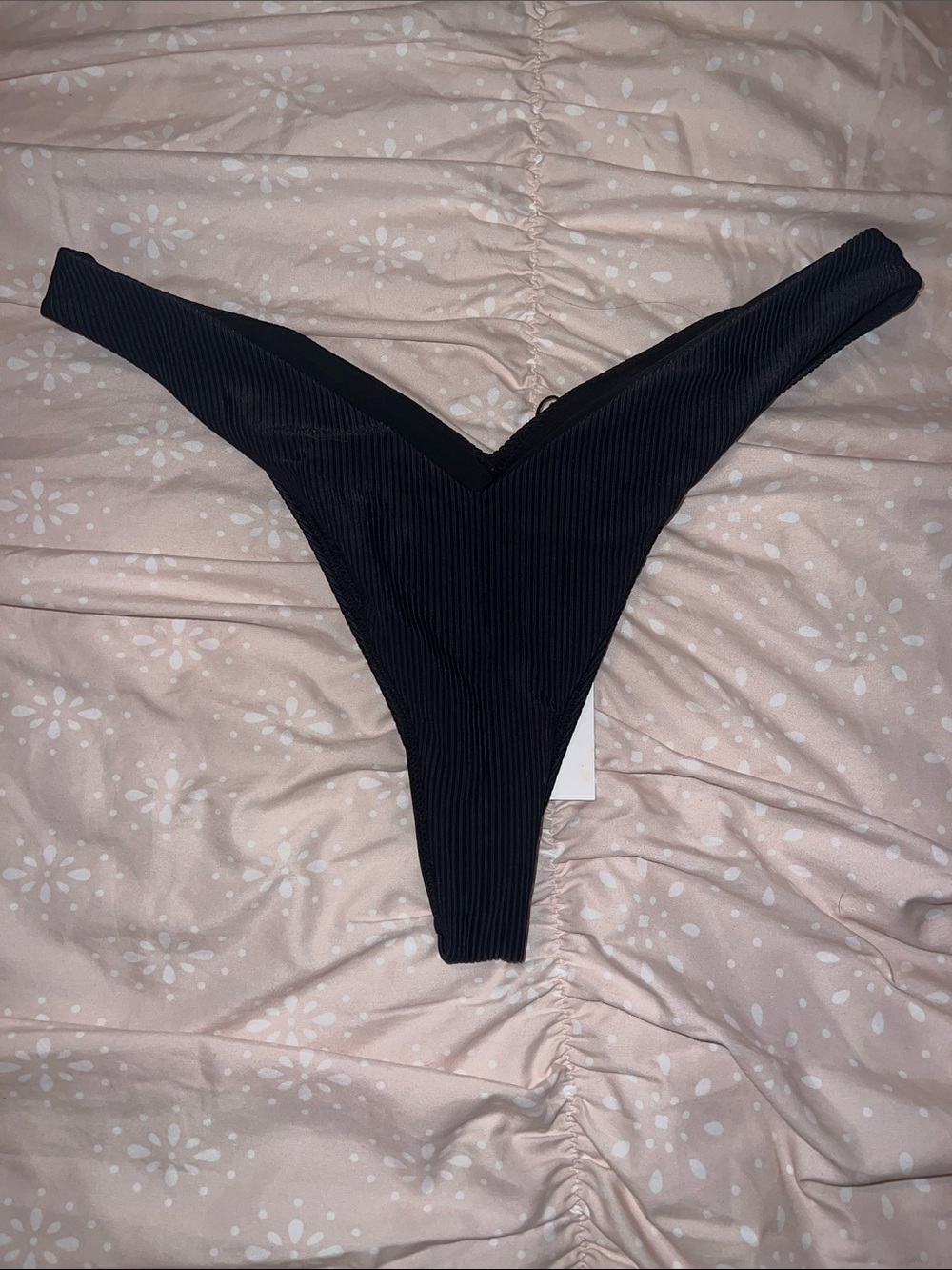 Black Ribbed thong bikini bottom.